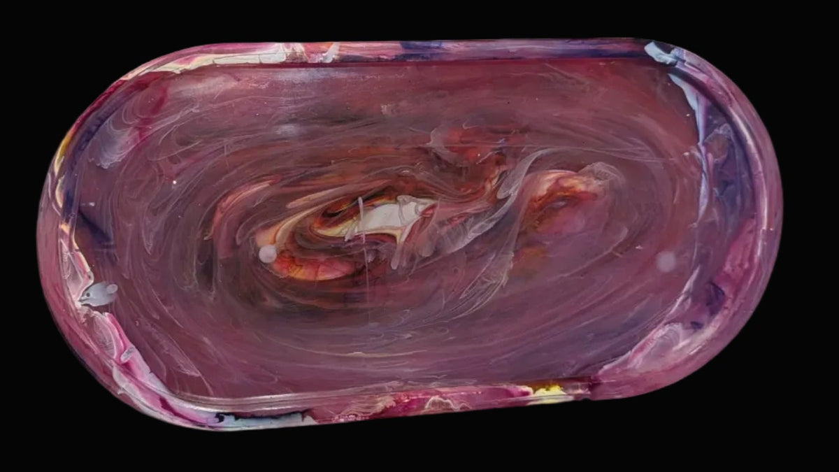 Large marbled oval resin tray with swirls of purple, pink, orange, and white.