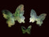 Three butterfly-shaped translucent green wall decor 