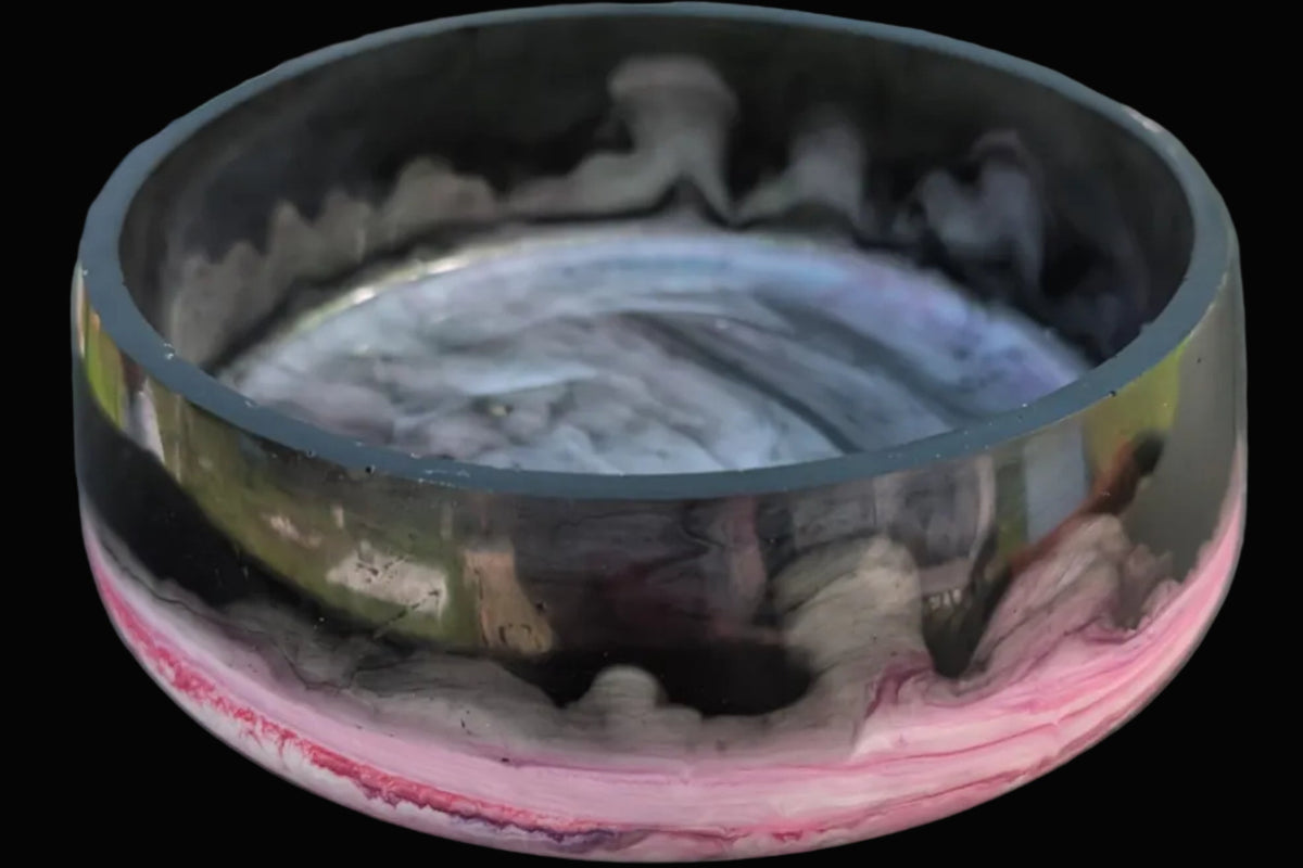 Large round bowl with pink and black marble. 