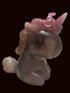 A translucent pink and mauve unicorn